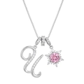 Macro detail of silver necklace with pavé letter U and snowflake pendant with pink stone - Box Chain / Silver U