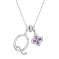 Detailed macro view of the silver Q letter pendant and purple clover zircon necklace - Silver Q