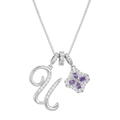 Macro shot of clover pendant with purple stones and zircon initial letter U on a gold chain - Silver U