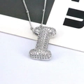 Detailed close-up of capital letter I pendant necklace with sparkling pavé zircons - Letter I Style