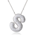 Macro shot of silver letter S pendant with iced out cubic zirconia stones for jewelry - Letter S Style