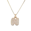 Détail de pendentif lettre N bulle avec pavé de zircons blancs et placage doré - Lettre N