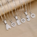 Mode 18k vergoldete Kupfer Buchstaben-Anhänger mit Zirkonia auf Seidenhintergrund - Buchstabe S / Silberne Baguette & Blume