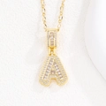 Iced out gold letter A pendant necklace with white crystals on white platform - Letter A / Baguette Letter With Irregular Chain