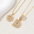 Golden necklace set with letter D pendant featuring sparkling cubic zirconia stones - Gold - Letter D