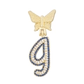 Detail of gold butterfly pendant with sparkling white diamonds and blue accented letter G - Letter I Style