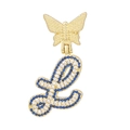 Macro view of gold butterfly pendant with letter L featuring blue and white pavé crystals - Letter L Style
