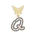 Detailed close-up of a gold-plated butterfly pendant with letter Q and blue zircon stones - Letter Q Style