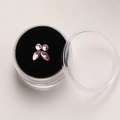 Close-up of pink marquise and round crystal tooth gems in a black velvet lined case - Large / Pink