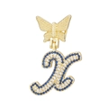 Detailed view of a golden butterfly pendant with blue and white zircon letter K - Letter X Style