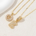 Golden pendant necklace with crystal letter K and sparkling cubic zirconia stones - Letter K