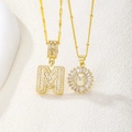 Gold plated iced out M letter pendant necklace with sparkling cubic zirconia stones - Baguette Letter and Floral Medallion Necklace Set (A)