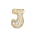 Macro detail of bubble letter J pendant in 18k gold plating with micro-paved cubic zirconia - Small Letter / Letter J Pendant