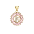 Macro view of gold-plated pendant with letter K, pink crystals and zircon stones - Gold K