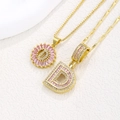 Pink zircon letter D pendant necklaces in gold plated finish with iced out crystals - Gold D