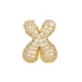 Macro shot of X-shaped gold pendant with micro-paved white zircon stones on white background - Letter X Pendant