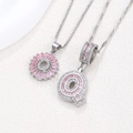Pink zircon letter Q and sun flower pendant necklaces set in silver-tone finish - Silver Q
