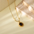 Elegant gold-tone beaded necklace with a cat-eye tiger eye teardrop pendant in warm lighting - Irregular Waterdrop Style (HC95)