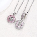 Silver letter U pendants set with pink rectangular zircons and white pavé stones - Silver U