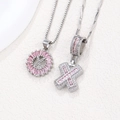 Silver-toned necklaces set featuring pink crystal letter X and cross shaped pendants - Silver X