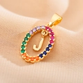 Macro detail of gold letter J pendant with rainbow colorful zircon pave setting - Letter J