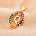 Detailed macro of gold-plated letter Q pendant with rainbow cubic zirconia stones - Letter Q
