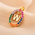 Detail of gold oval pendant with rainbow cubic zirconia and capital letter W charm - Letter W
