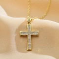 Close-up of gold-plated cross pendant necklace with micro-pave white zircon stones - White