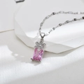 Elegante strik en bloem hanger ketting met roze zirkoon en zilveren afwerking op wit deco - Zilveren Ketting