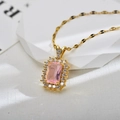 Close-up of golden necklace with a rectangular pink gemstone and zircon halo detail - Gold Pink Necklace