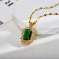Detailed close-up of emerald-cut green zircon necklace with gold plating and halo diamonds - Gold Green Necklace