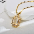 Macro shot of rectangular clear zircon necklace with halo setting and gold link chain - Gold White Necklace