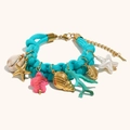 Detail of blue braided bracelet with golden starfish, turtle and coral charms - Blue Woven Rope Ocean Elements Pendant Bracelet - Gold