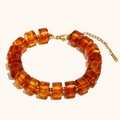 Handmade 18K gold plated stainless steel bracelet with amber acrylic drum beads - Bracelet / Amber