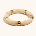 Elastic bracelet featuring cream marble resin tube beads and gold polished metal spacers - White