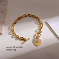 Detail of gold toggle clasp bracelet with dual heart charms and micro pavé crystals - Full Rhinestone Toggle Clasp Style (Heart 3)