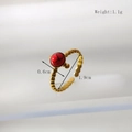 Detail of adjustable gold ring with red gemstone showing 0.6cm diameter and 1.1g weight - Beaded Texture Style (HC038)