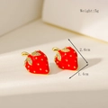 Macro view of mini red strawberry stud earrings with gold plating and zircon details - Rhinestone Strawberry Stud Earrings