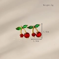 Detail view of 18K gold plated cherry earrings with red and green crystals and dimensions - Stud Earrings