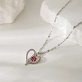 Elegant silver heart necklace with a red rose and sparkling zircon on a stone background - Silver