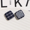 Macro detail of square blue plaid fabric buttons with smooth metal backing for DIY crafts - Rounded Square Style / Blue