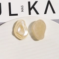 Detail of irregular faux pearl acrylic charms in pearl beige and matte frosted finish - No.1 Smooth Irregular Shape (6160087746299)
