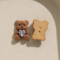 Detail of brown flocked bear button with a clear heart-shaped rhinestone and dual-hole back - Light Coffee