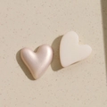 Close-up of heart-shaped pearl and matte acrylic DIY charms for jewelry making - One Light Gold