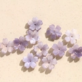 Close-up of pearlized light purple five-petal acrylic flower beads for DIY jewelry making - 1 Piece / Purple Series