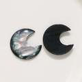 Detail of moon-shaped iridescent and black resin shell components for DIY jewelry making - Black