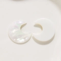 Macro detail of resin crescent moon earring charms with pearlescent and solid finish - White