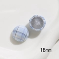 Detail view of 18mm light blue plaid fabric button with high-quality metal back - Small Round Style / Blue