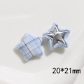 Detail of pink and blue fabric plaid star buttons with metal inserts for DIY clothing - Star Style / Blue