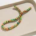 Detail of 8mm round beads with colorful splatter pattern for DIY jewelry making - 8mm (Approx. 50 Pieces/Strand) / Green